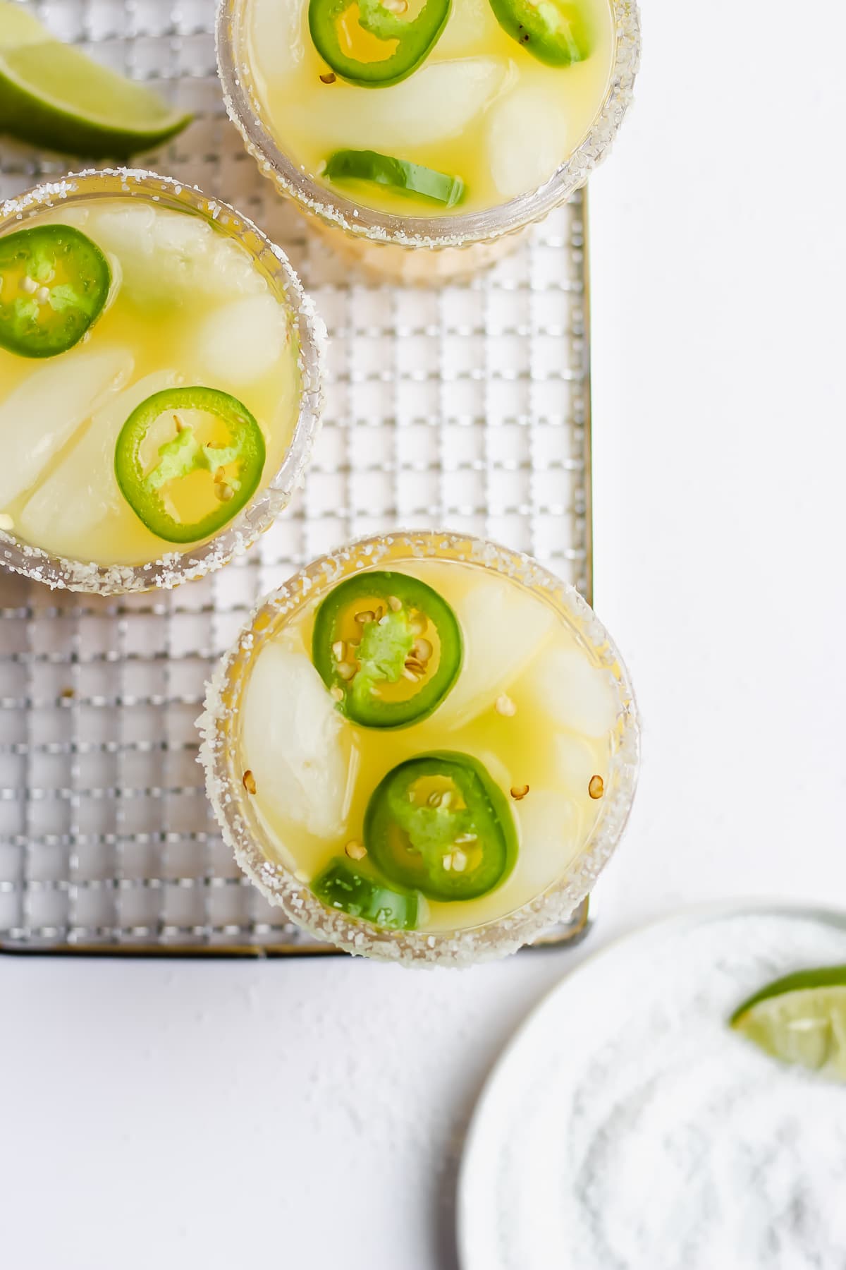 Top shot of three jalapeno margarita mocktails. 