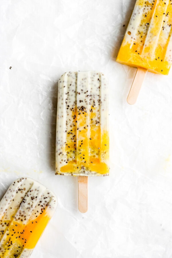 Three mango banana chia pudding pops.
