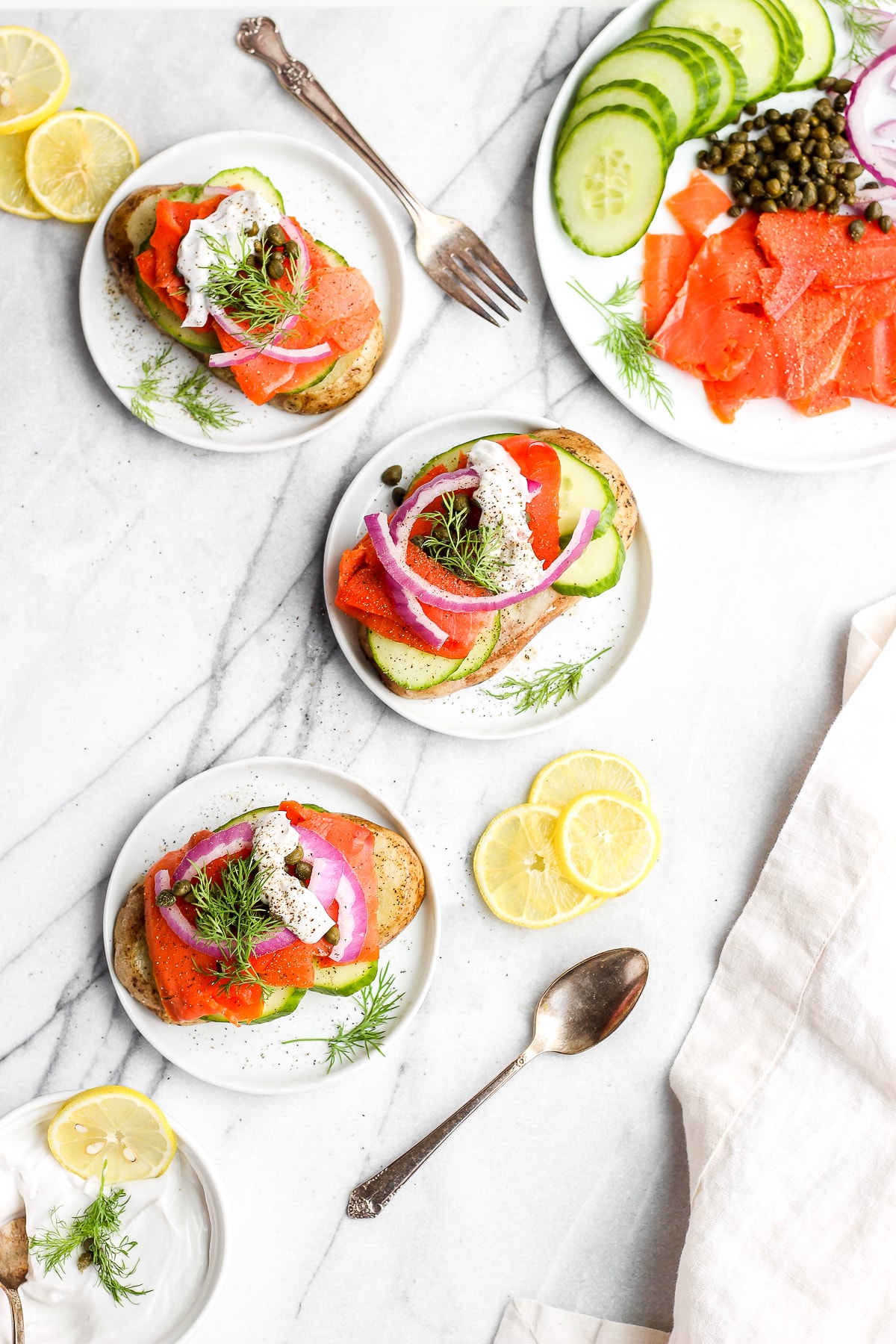 A few slices of smoked salmon toast on a plates.