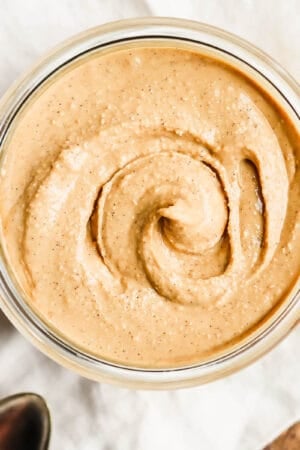 A top shot of a container of cashew butter.