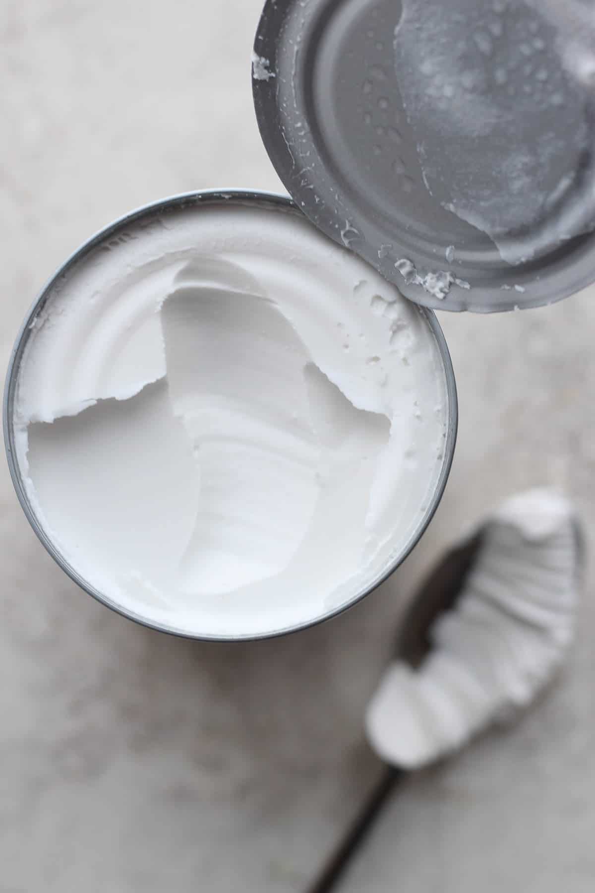 A can of coconut cream, opened.