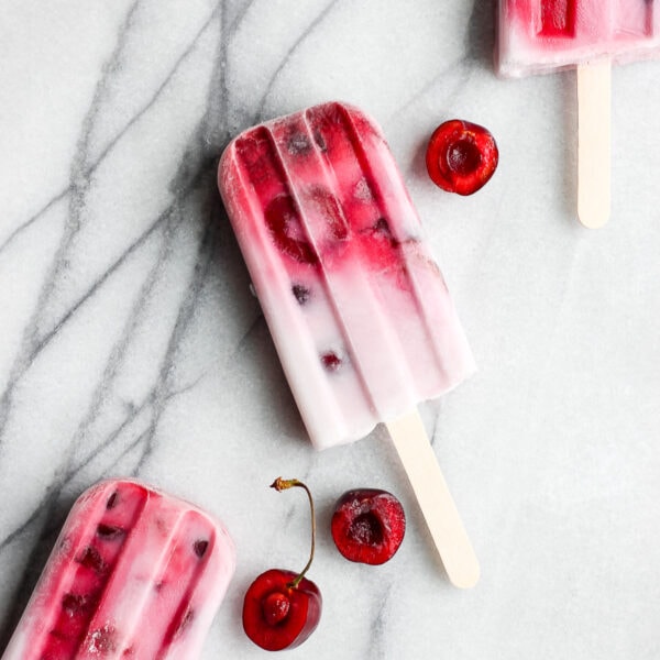 Healthy Strawberry Cherry and Cream Popsicles - a delicious summer treat that is vegan and dairy-free! #popsicles #vegan #dairyfree