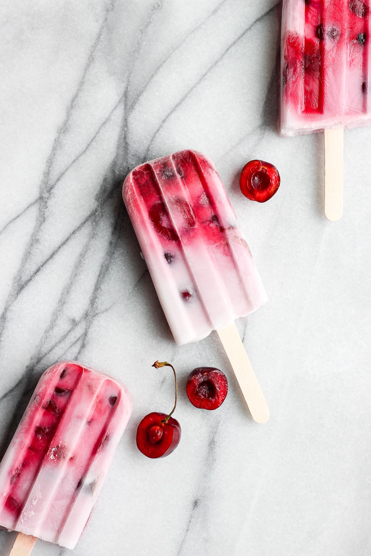 Healthy strawberry cherry and cream popsicle recipe.
