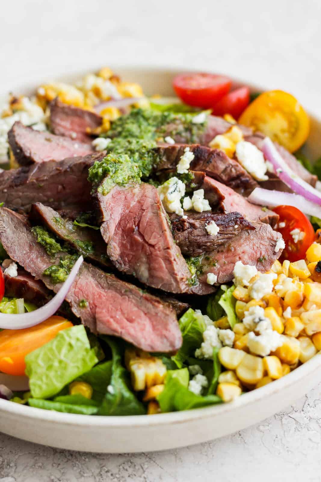 Side view of a flank steak salad.