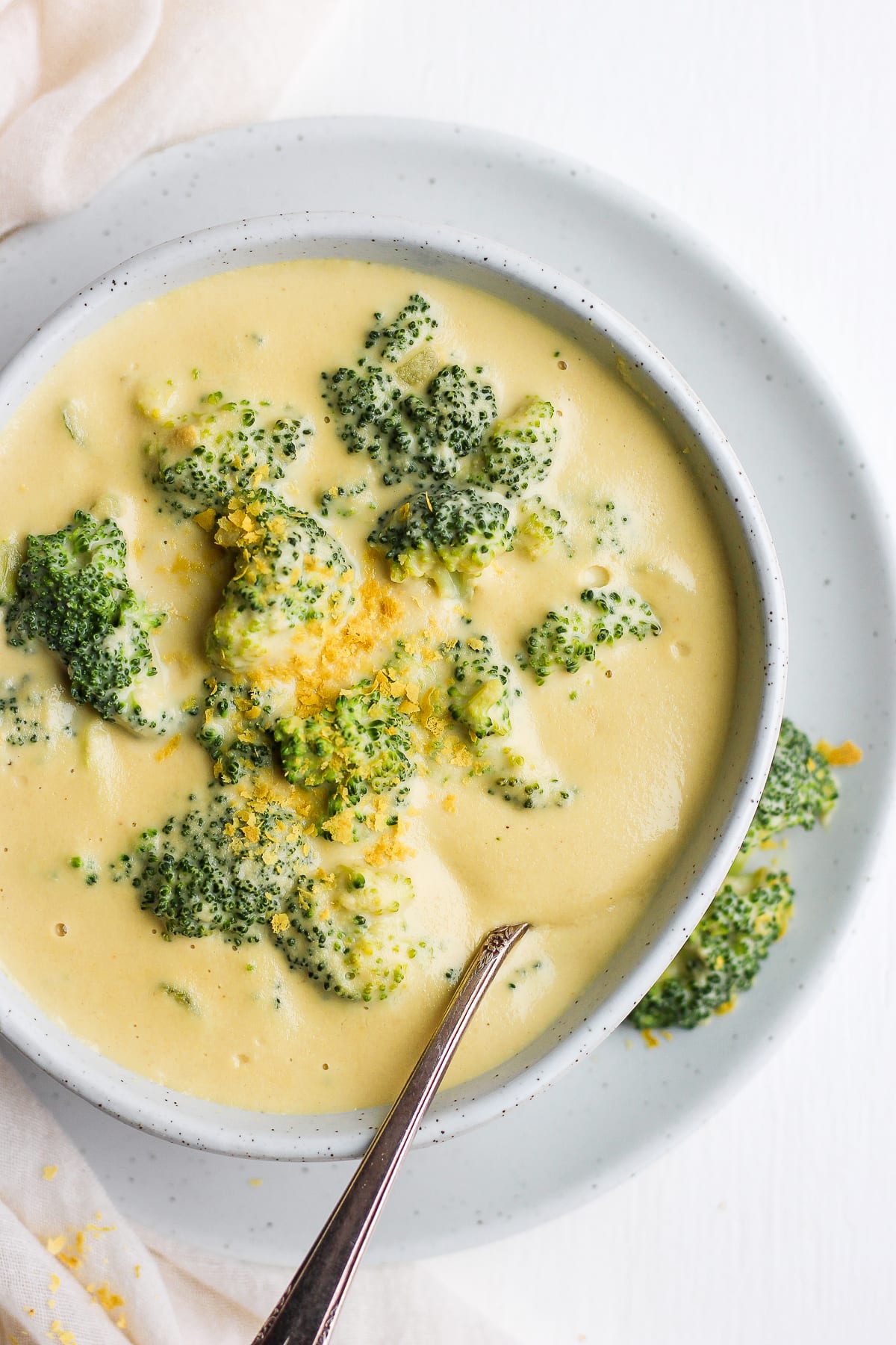 A close-up shot of dairy free broccoli cheese soup in a bowl.