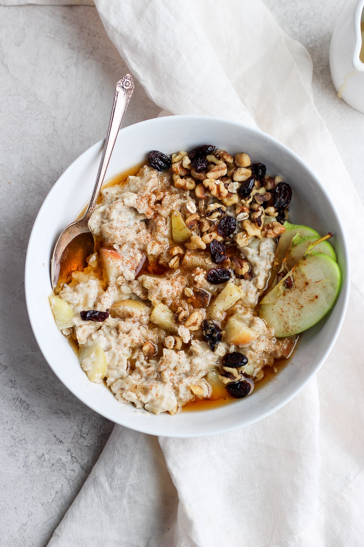 Apple pie oatmeal with all the toppings.