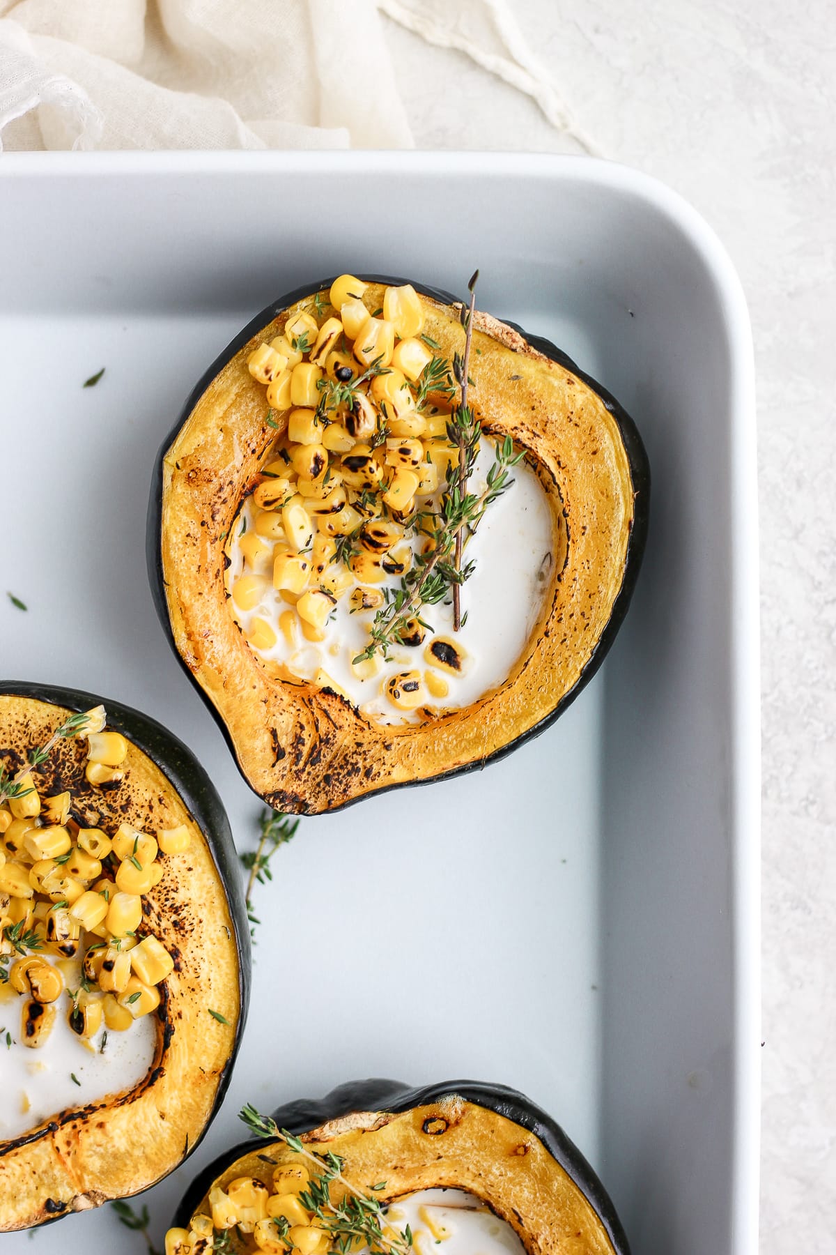 Baked Creamy Acorn Squash - a creamy and delicious side dish that is dairy-free, vegan and gluten-free! #acornsquash #dairyfreerecipes #dairyfree #vegan #plantbased #creamedcorn #foodphotography #christmasdinner #thanksgiving