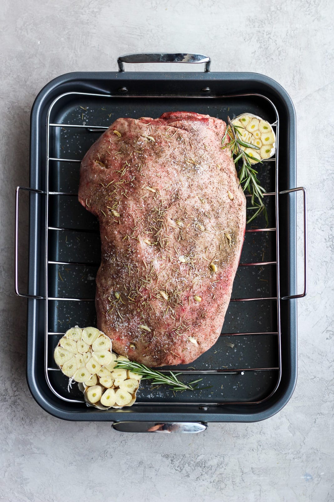 Roasted leg of lamb covered in lamb seasoning.