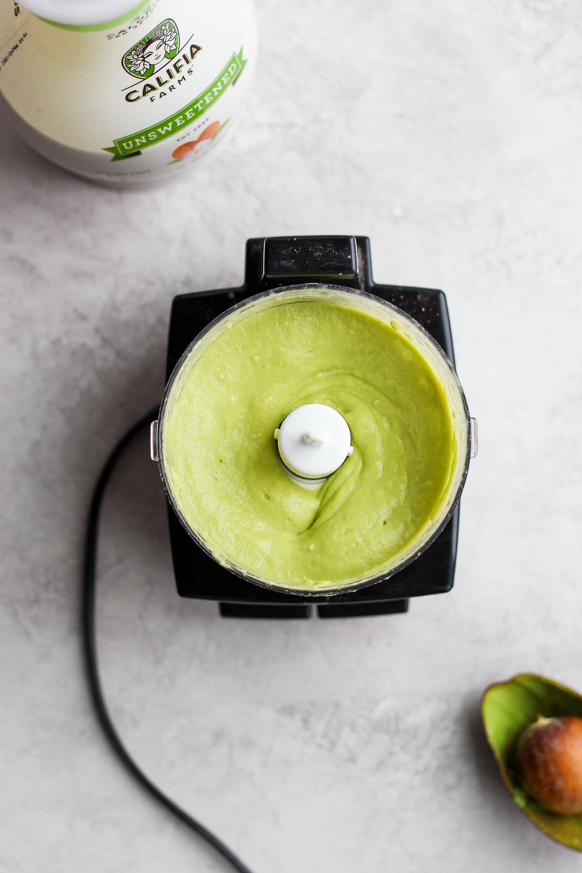 Avocado crema in a small food processor.