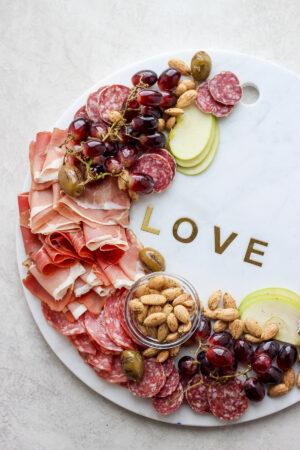 Romantic Valentine's Day Dinner for Two - a delicious and fun tasting boards for two! #valentinesdaydinnerfortwo #dinnerfortwo #valentinesdaydinner #valentinesday #grazingboard #charcuterie #charcuterieboard #datenight #glutenfree #grainfree #dairyfree #foodphotography