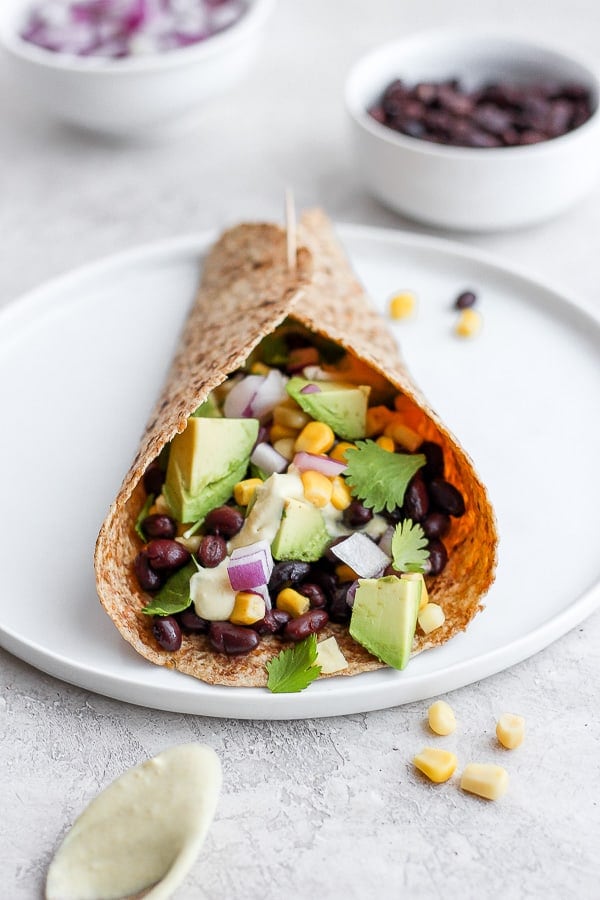 Easy Black Bean and Avocado Wrap - a quick and easy plant based meal you will love!!! #plantbased #wrap #blackbeanwrap #avocado #healthymealideas