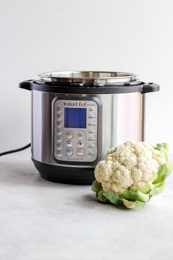 Instant Pot Cauliflower (Whole Cooked) - how to cook a whole head of cauliflower in the Instant Pot® (it's so easy). #instantpot #cauliflower #roastedcauliflower #instantpotcauliflower #plantbased #whole30 #paleo