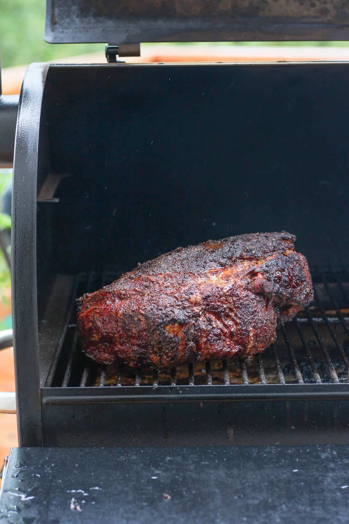 Smoked pork shoulder on a smoker. 