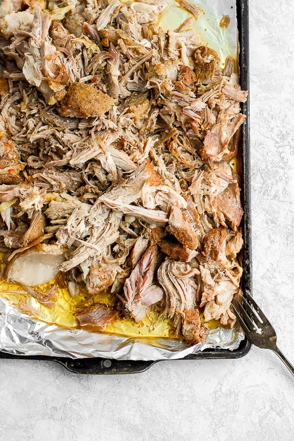 A foil-lined pan with sous vide pork shoulder on it. 