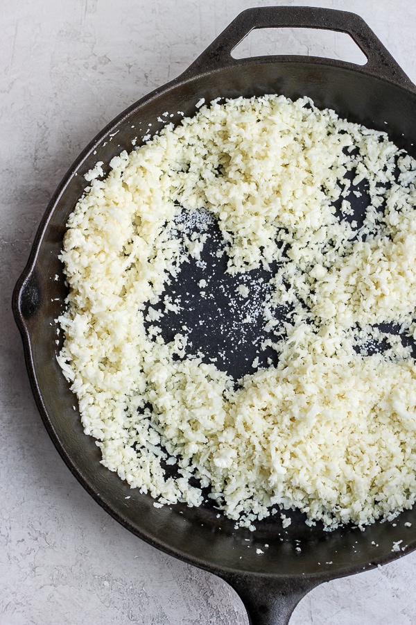 Cauliflower Rice in a cast iron skillet. 