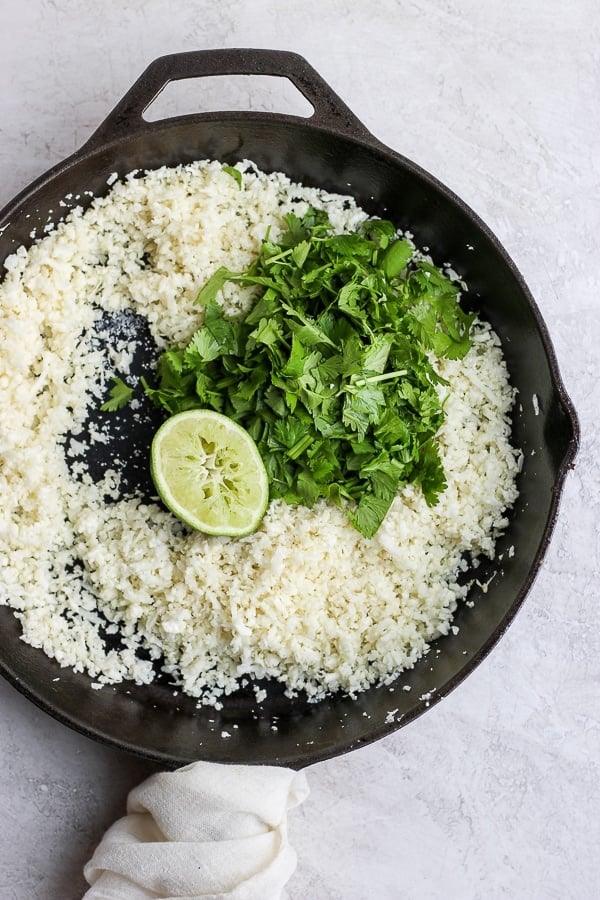 Cilantro Lime Cauliflower Rice in a cast iron skillet. 