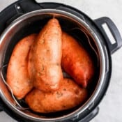 Four whole sweet potatoes in an Instant Pot.