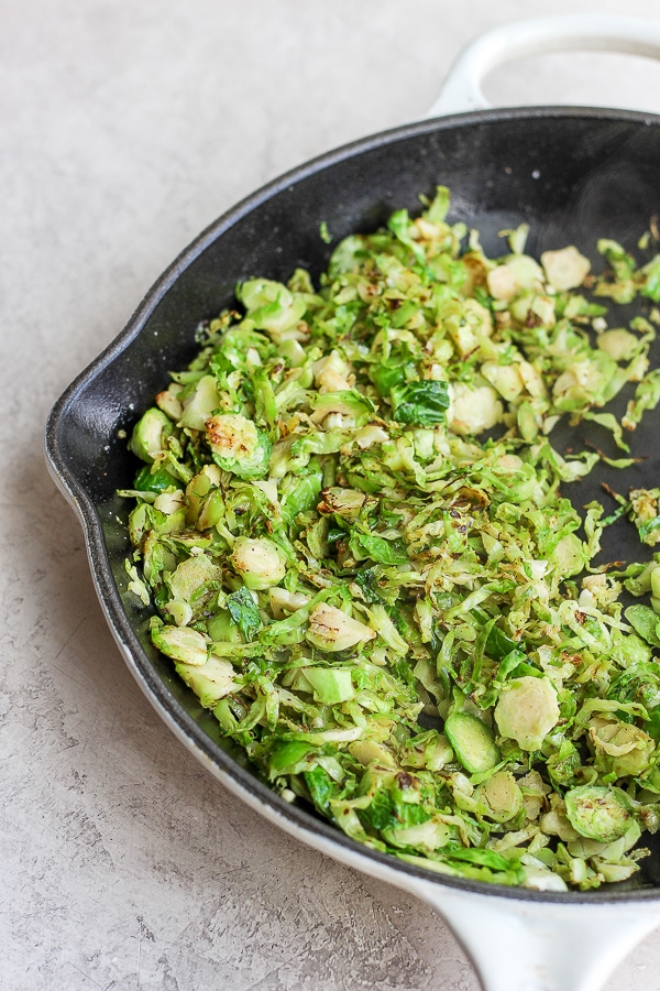 shaved brussel sprouts on a cast iron skillet. 