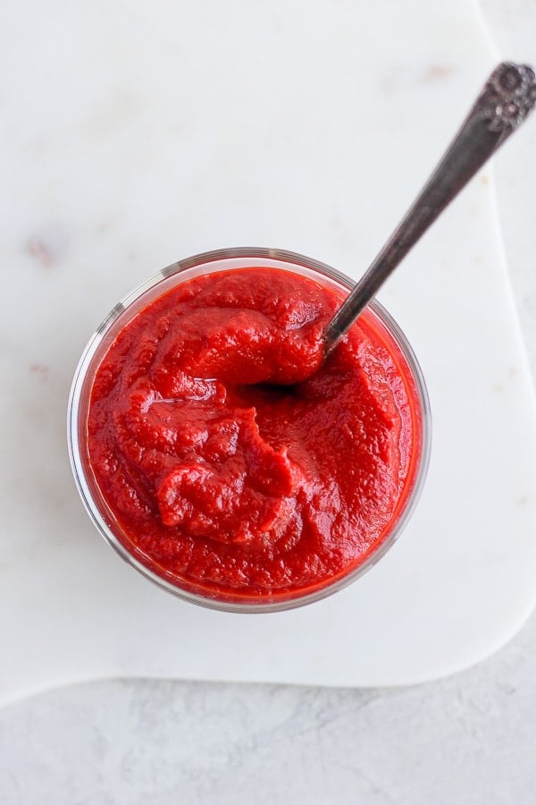 A shot over the top of the glass with ketchup.