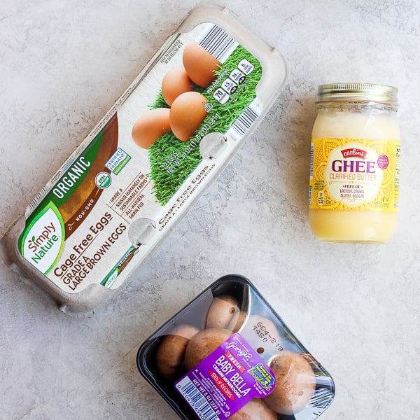 Eggs, ghee, and mushrooms on the counter.