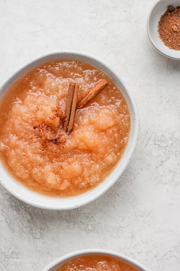 Slow Cooker Applesauce - a set-it-and-forget-it recipe that is perfect for your Fall apples! (Dairy-Free + Paleo + Vegan) #slowcookerapplesauce #homemadeapplesauce #sugarfreeapplesauce A bowl of slow cooker applesauce.