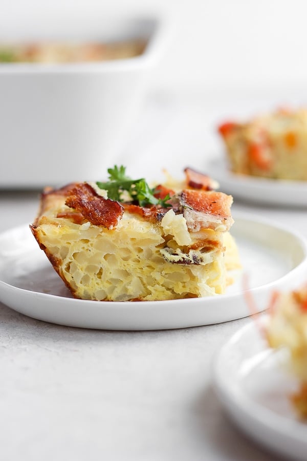 Side view of a whole30 breakfast casserole slice on a plate.