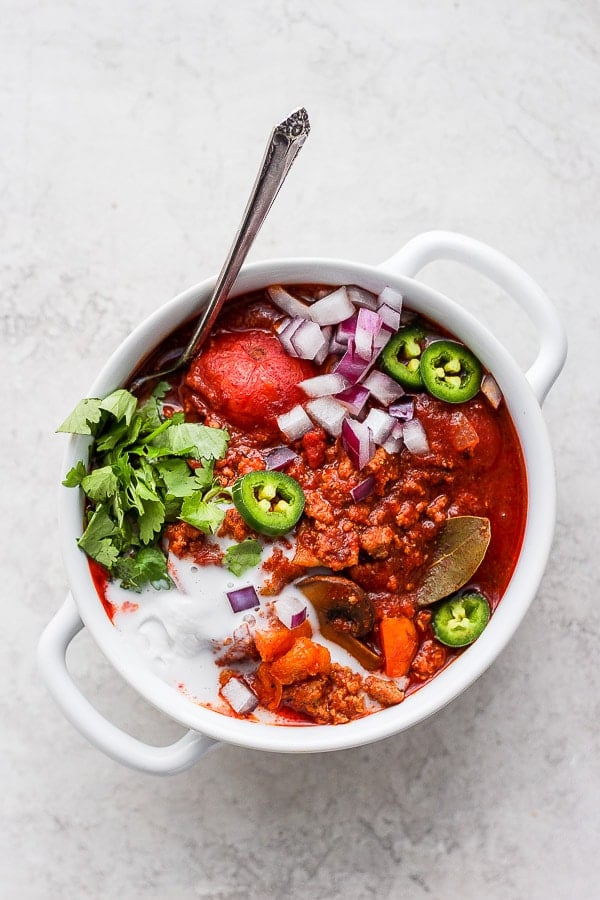 A bowl of the best turkey chili with all the toppings.