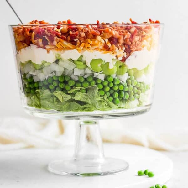A dish filled with seven layer salad.