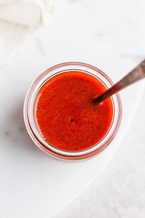 Top shot of buffalo sauce in a glass jar.