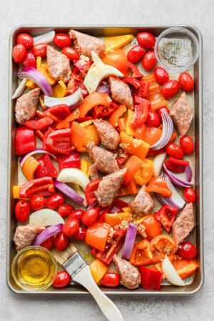 Sheet Pan Sausage and Veggies - the perfect weeknight meal! Easy, delicious and barely any clean-up! #sheetpanmeals #sheetpansausageandveggie #glutenfreemeals #easyweeknightmeals #whole30dinner #paleodinner