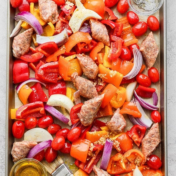 Sheet Pan Sausage and Veggies - the perfect weeknight meal! Easy, delicious and barely any clean-up! #sheetpanmeals #sheetpansausageandveggie #glutenfreemeals #easyweeknightmeals #whole30dinner #paleodinner