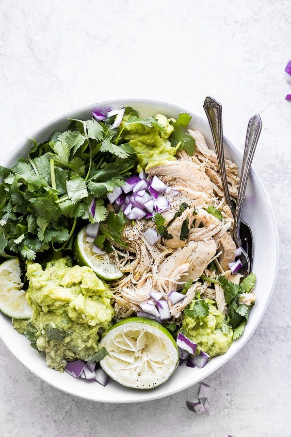 Crockpot Cilantro Lime Chicken - an easy and delicious weeknight dinner you can set and forget! (Whole30 + Paleo + GF + DF) #slowcookerrecipes #crockpotrecipes #cilantrolimechicken #crockpotcilantrolimechicken #slowcookercilantrolimechicken #whole30dinner #paleodinner #dairyfreerecipes #healthychickenrecipes