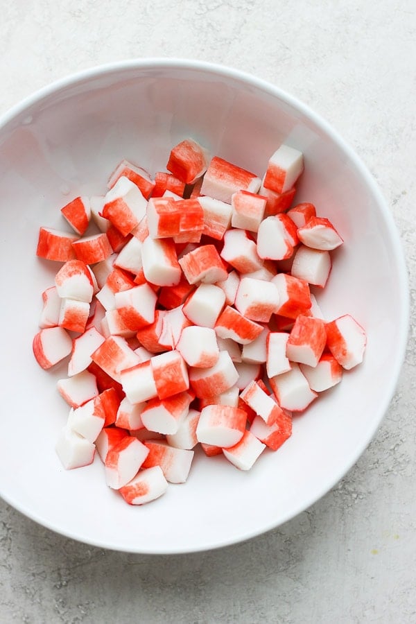 Chunks of crab in a white bowl.