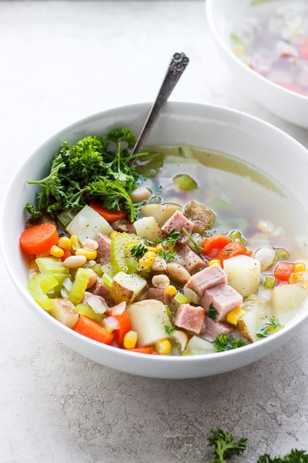 Another view of the ham bone soup in a bowl.