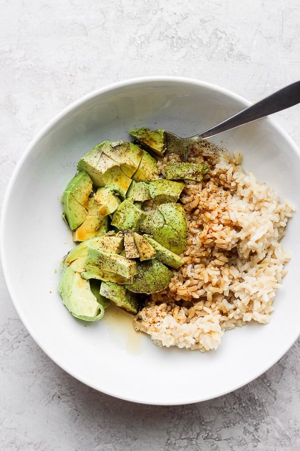 Avocado + Brown Rice Bowl - My favorite, simple go-to lunch/dinner that is amazing on its own, but feel free to add in some protein too! So many options!  Kid-friendly and perfect for a quick and easy weeknight dinner! (Dairy-free + GF) #brownricebowls #plantbasedrecipes #avocadorecipeshealthy #avocadorecipes #avocadobrownricebowls