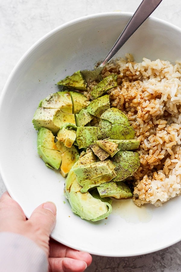 Avocado + Brown Rice Bowl - My favorite, simple go-to lunch/dinner that is amazing on its own, but feel free to add in some protein too! So many options!  Kid-friendly and perfect for a quick and easy weeknight dinner! (Dairy-free + GF) #brownricebowls #plantbasedrecipes #avocadorecipeshealthy #avocadorecipes #avocadobrownricebowls