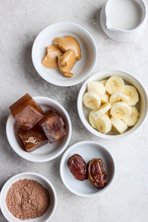 coffee smoothie ingredients separated in white bowls. 