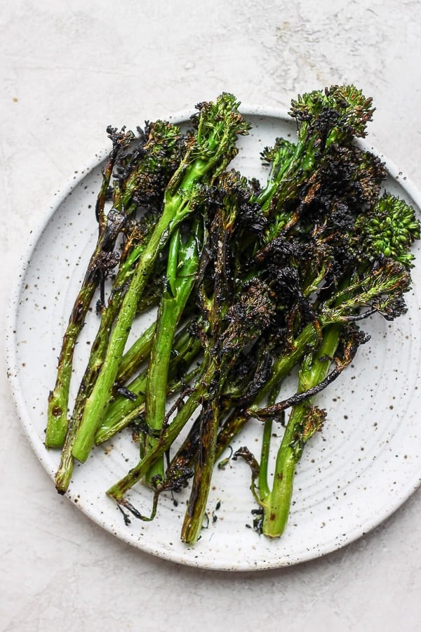 Grilled broccolini on a plate. 