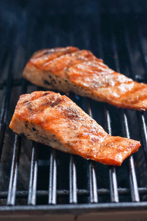 Two salmon filets on the grill. 
