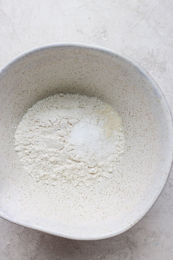Dry ingredients for a gluten free pie crust in a bowl.