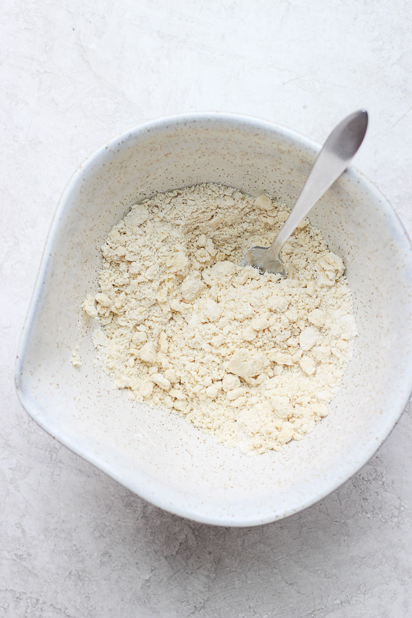 Plant-based butter fully cut into the flour mixture with a fork.
