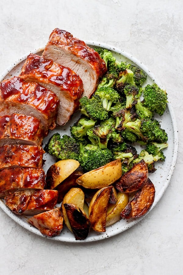 Grilled broccoli with a pork tenderloin, & grilled potato wedges.