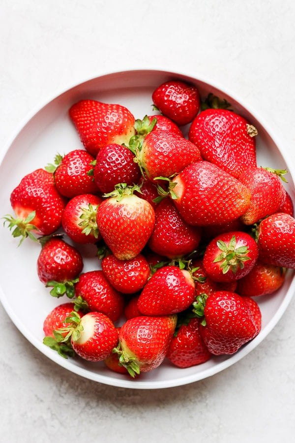 A bowl of clean, fresh strawberries.