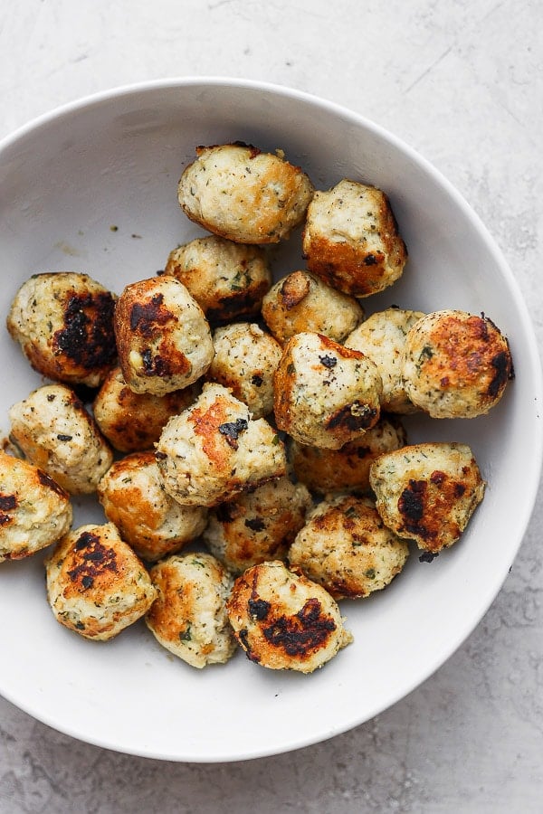 Greek chicken meatballs in a bowl. 