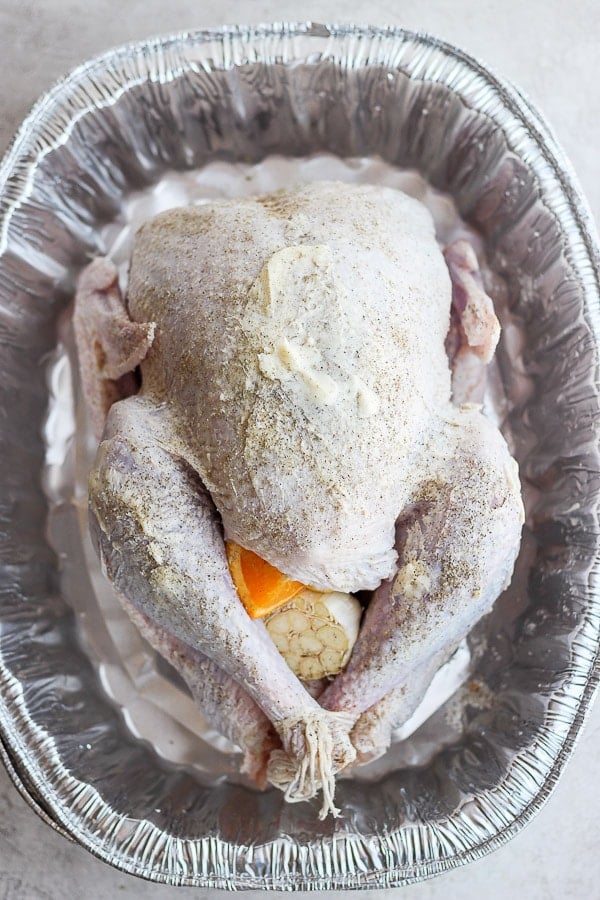 Top shot of a raw turkey ready to go on the grill. 