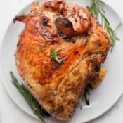 A grilled turkey breast on a plate.