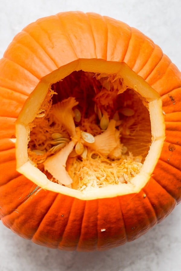 Large pumpkin with the top carved out.