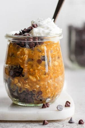 Pumpkin overnight oats in a glass jar.