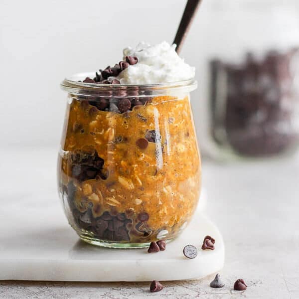 Pumpkin overnight oats in a glass jar.