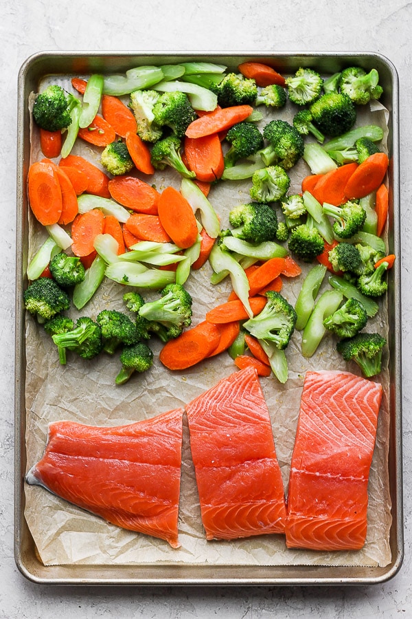 Sheet pan of teriyaki salmon with vegetables.